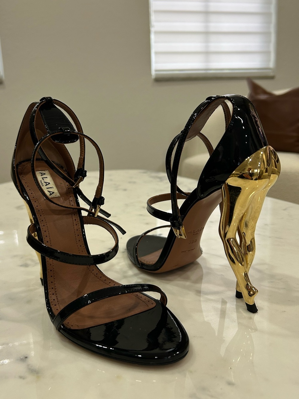 Alaïa Black Patent Leather Strappy Sandals with Gold Sculptural Heel